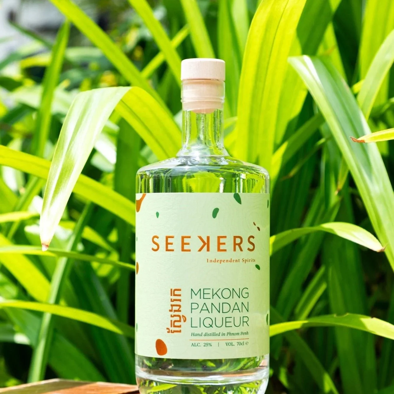 Seekers Mekong Pandan Liqueur bottle among pandan leaves