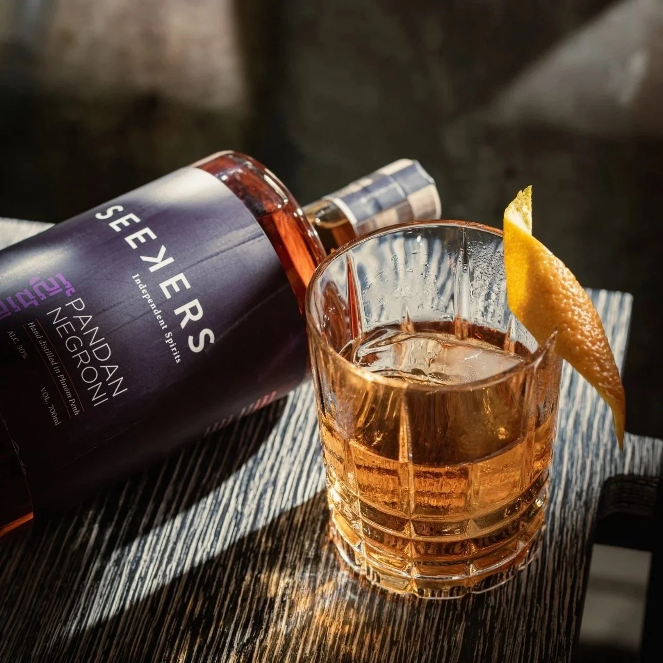 Seekers Pandan Negroni bottle and cocktail on ice with orange twist