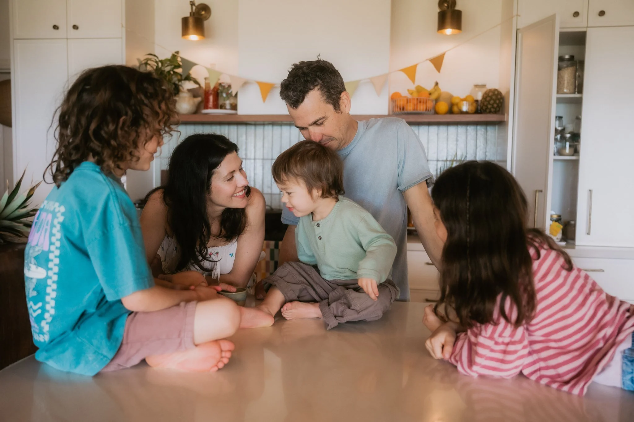 Gold coast family in their kitchen for a photoshoot