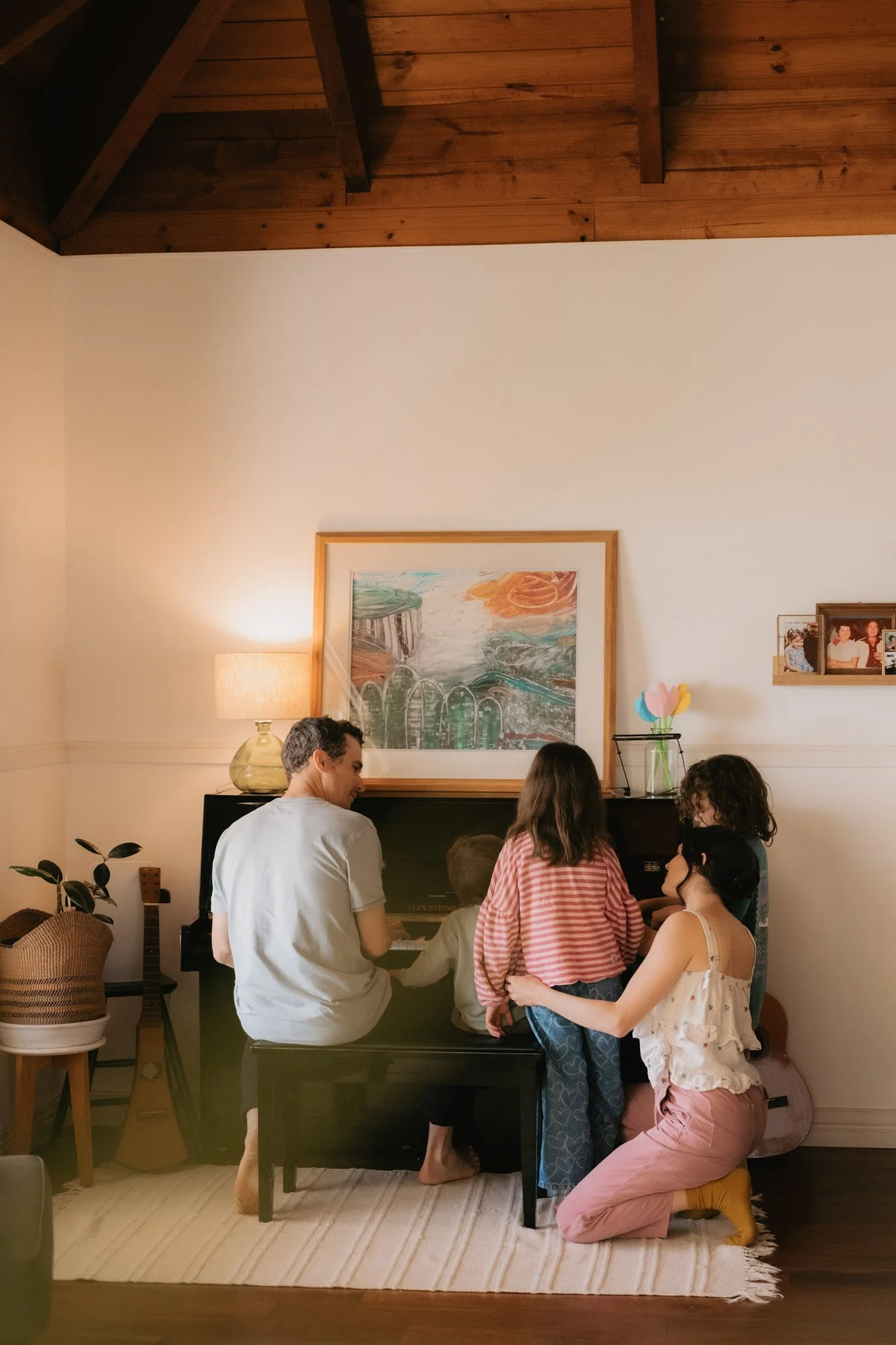 gold coast family playing the piano at home