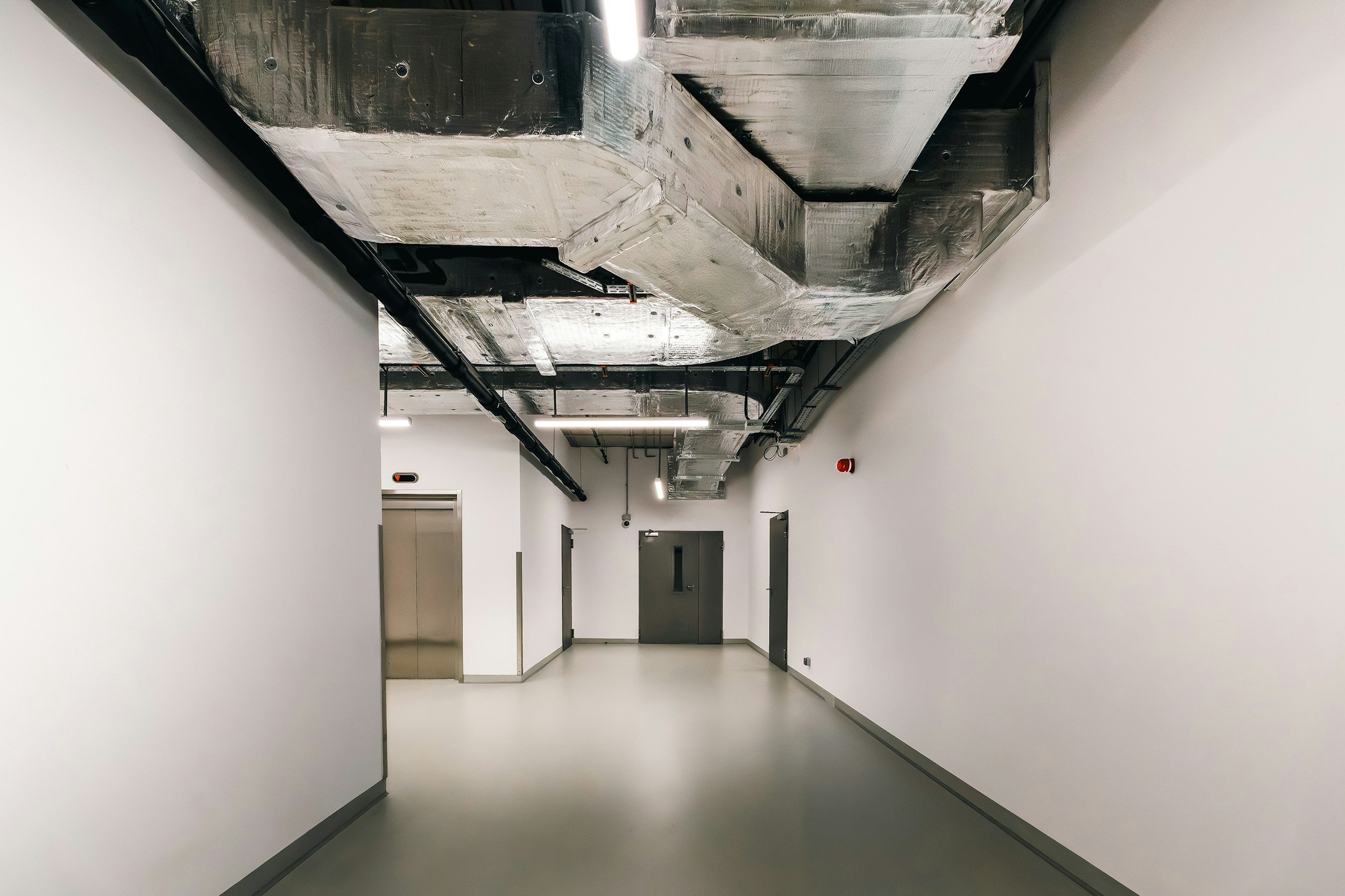 The Industrial Aesthetic: Taming Noise in Exposed-Soffit Offices