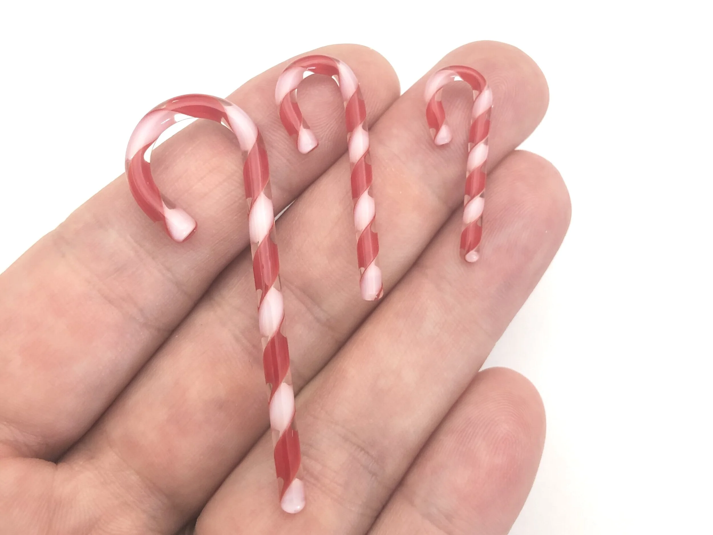 Candy Canes Red White Three Sizes in Hand.jpg