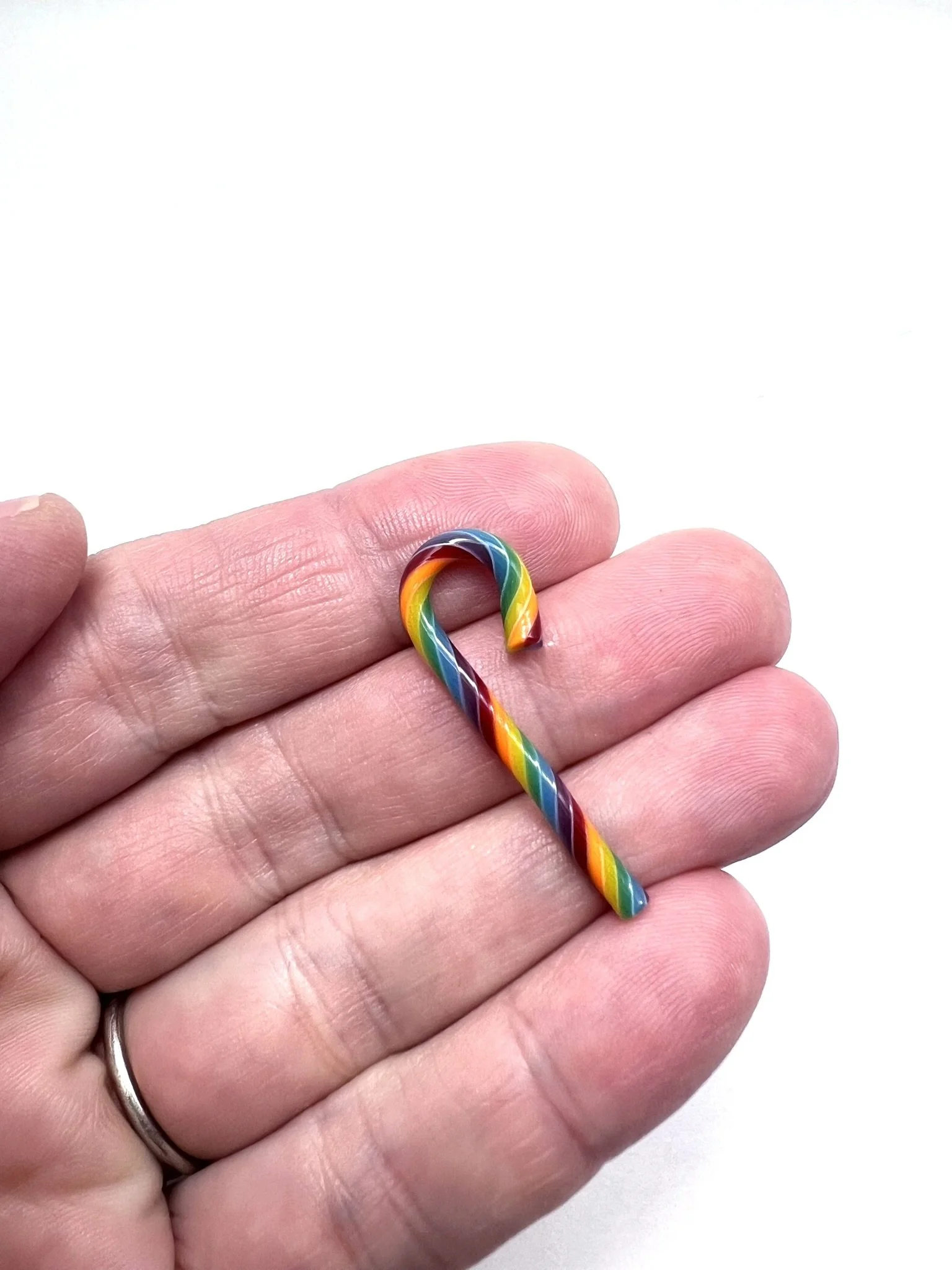 Rainbow Candy Cane Medium in Hand.JPEG