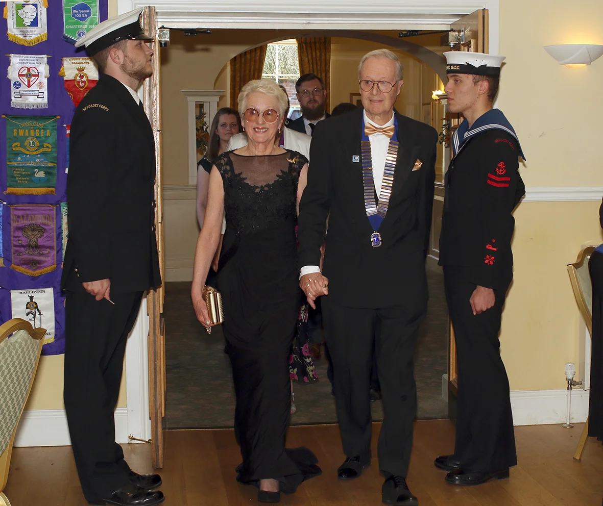 Beccles Lion President Chris Lambert with his wife Carolyn enter the Waveney Suite after being ‘piped in’ by the Beccles Sea Cadets.