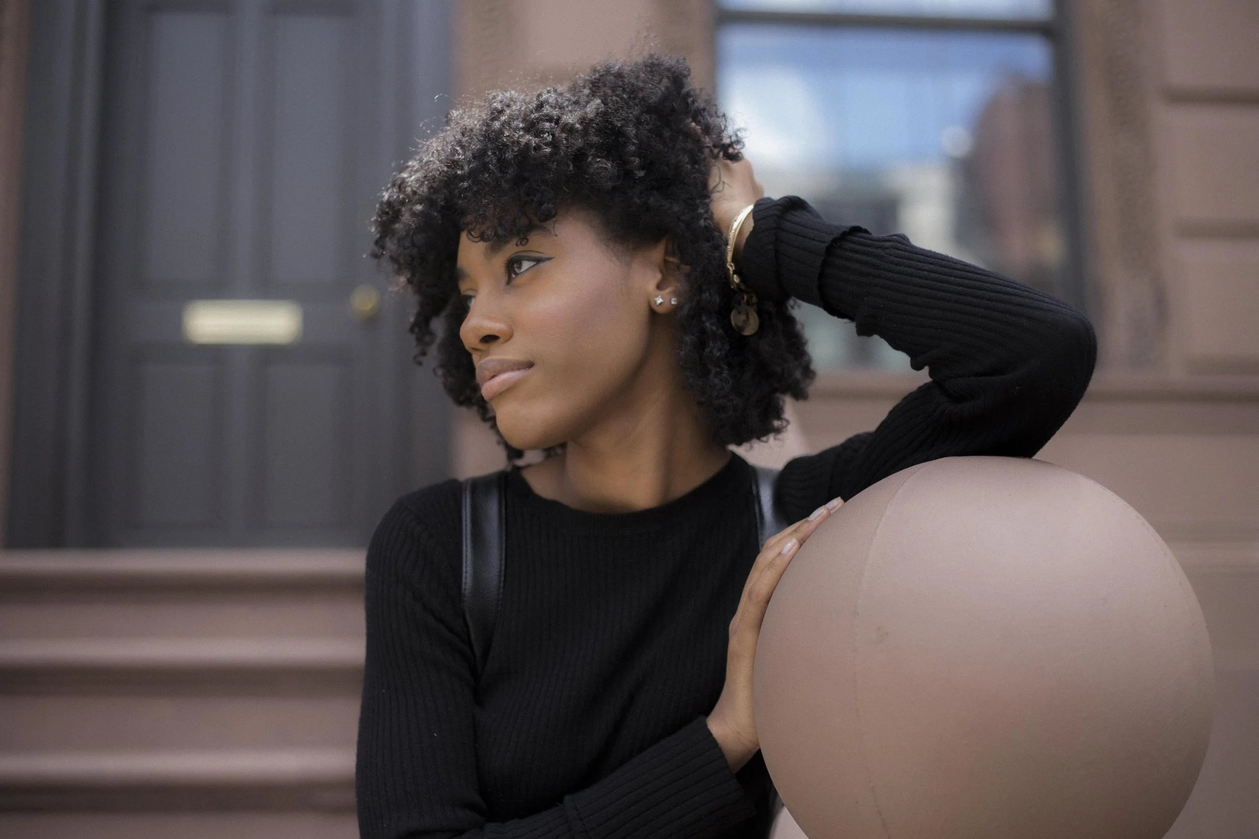 woman-outside-brownstone_4460x4460.jpg
