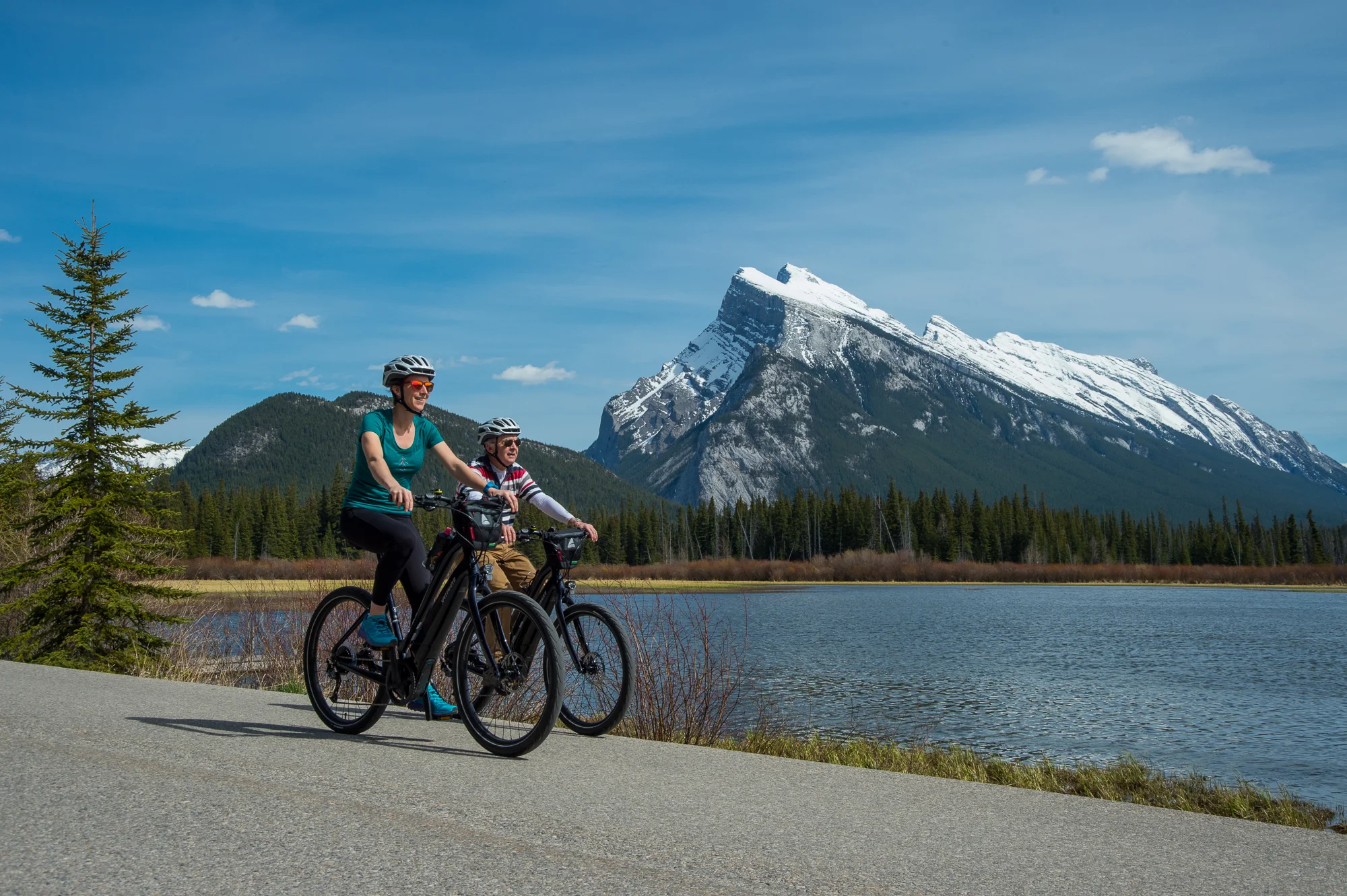 Riding past Vermillion Lakes, with Mount Rundle in the background.