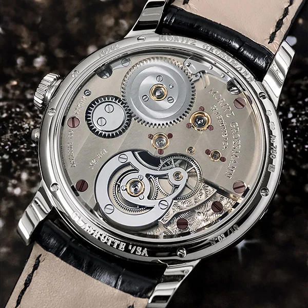 The balance cock and the Moritz Grossmann name are both engraved by hand.