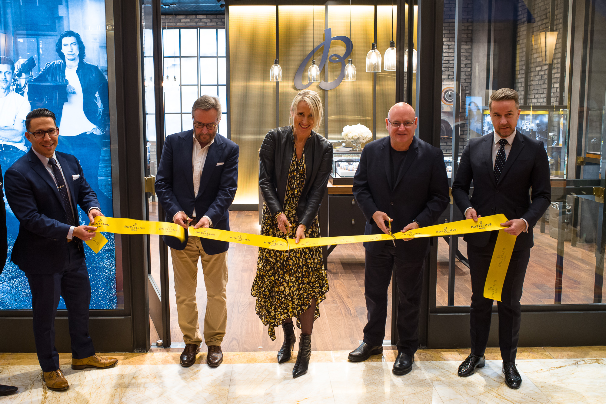 WoS CEO Brian Duffy, Breitling Retail Director Sophie Morice, and Commander Scott Kelly cutting the ribbon at the Esplanade Shops new Breitling Boutique in the Wynn.