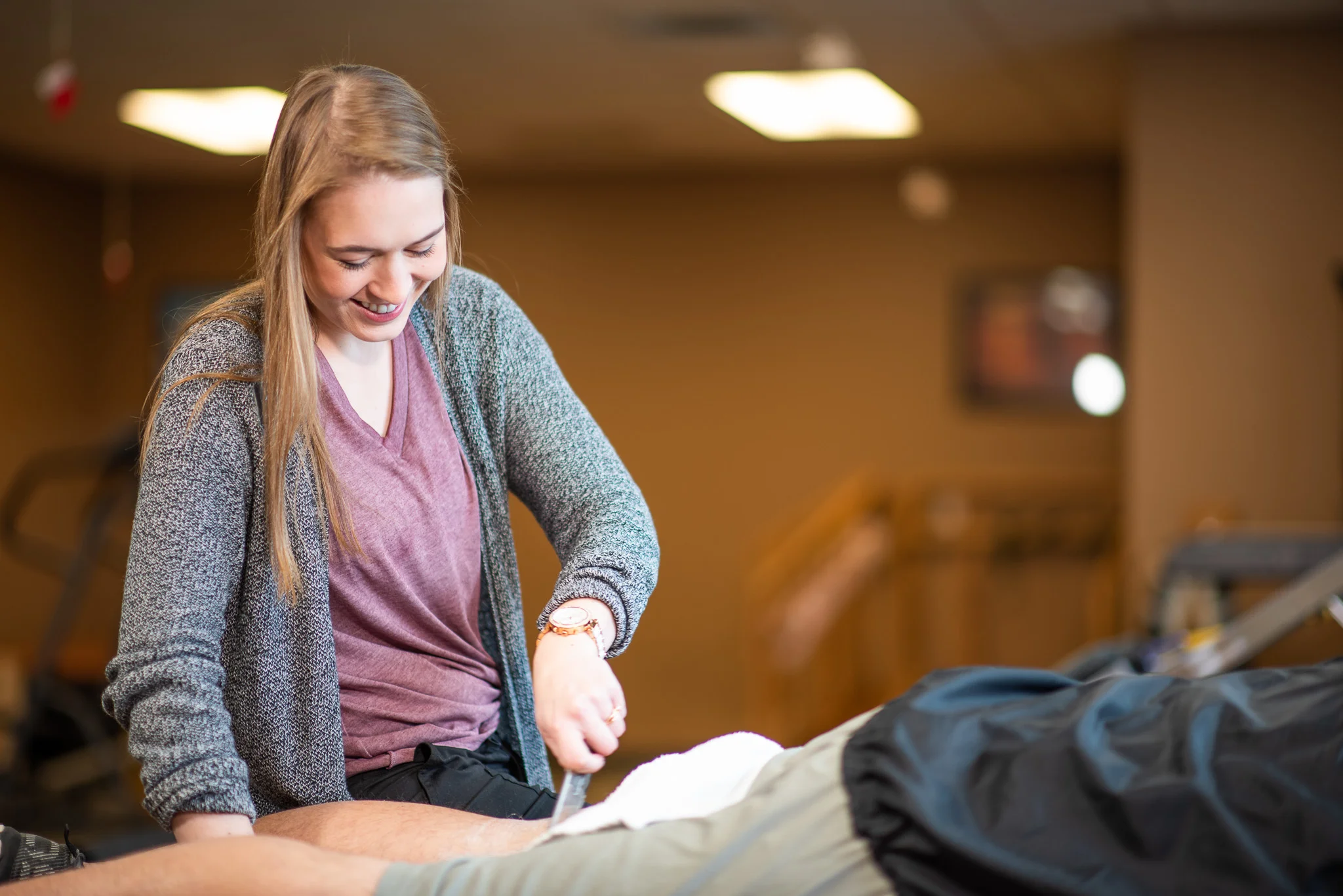 Kendall Zacha, PTA treating a knee patient with the Graston Technique .