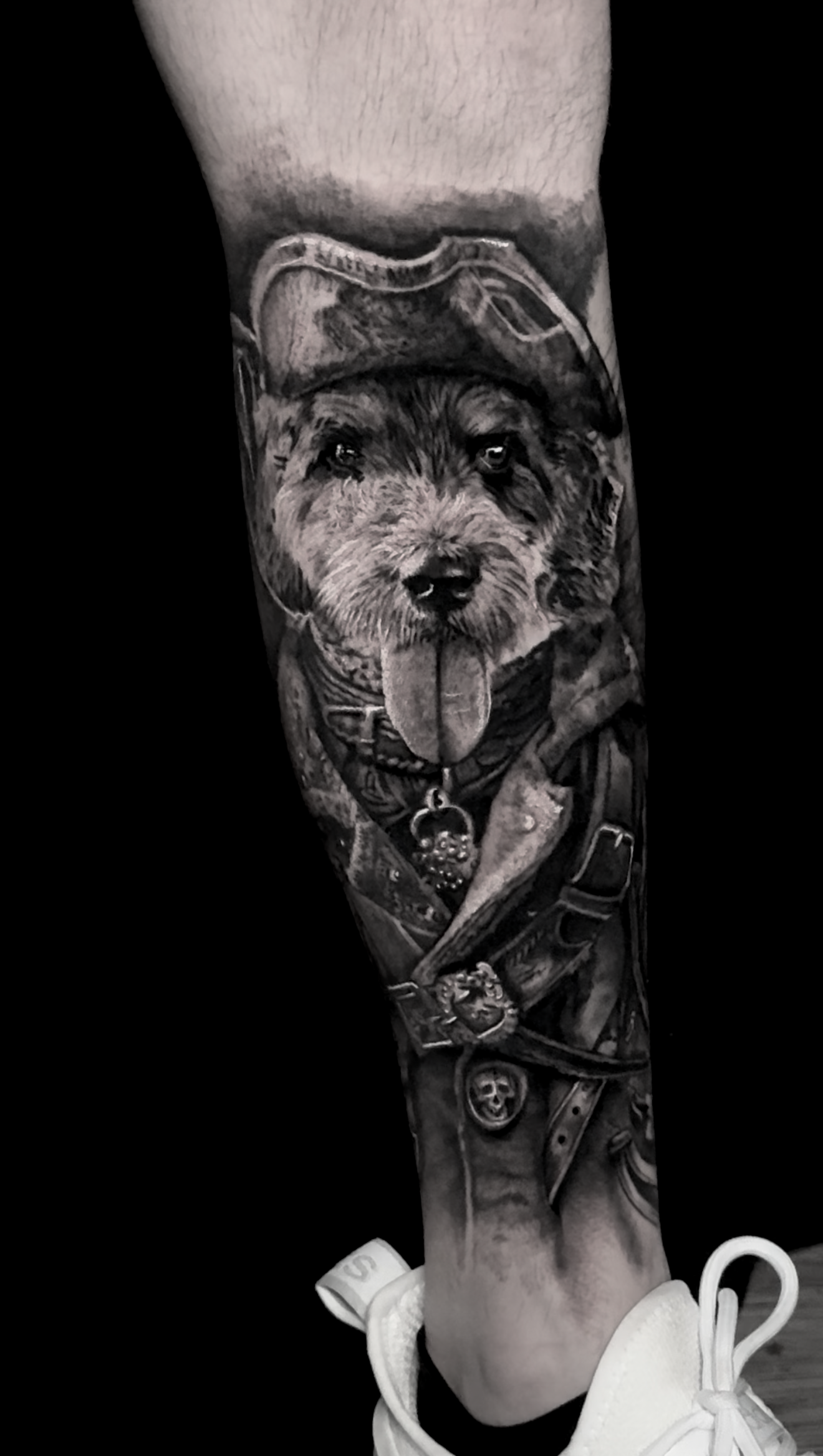 black-and-grey-realism-pirate-dog-portrait-parot-tattoo.png