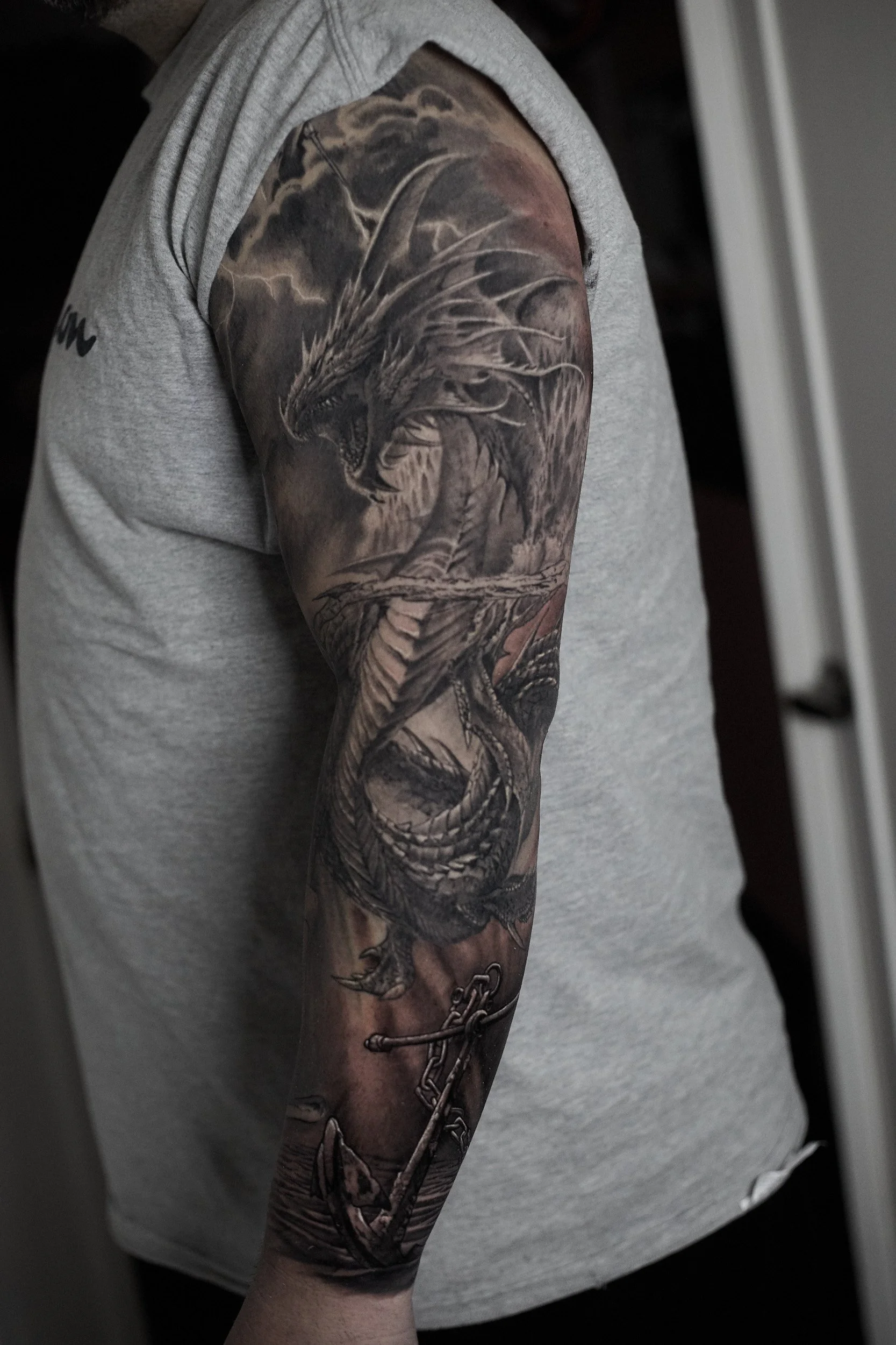 bible-story-water-dragon-realism-black-and-grey-tattoo.jpg