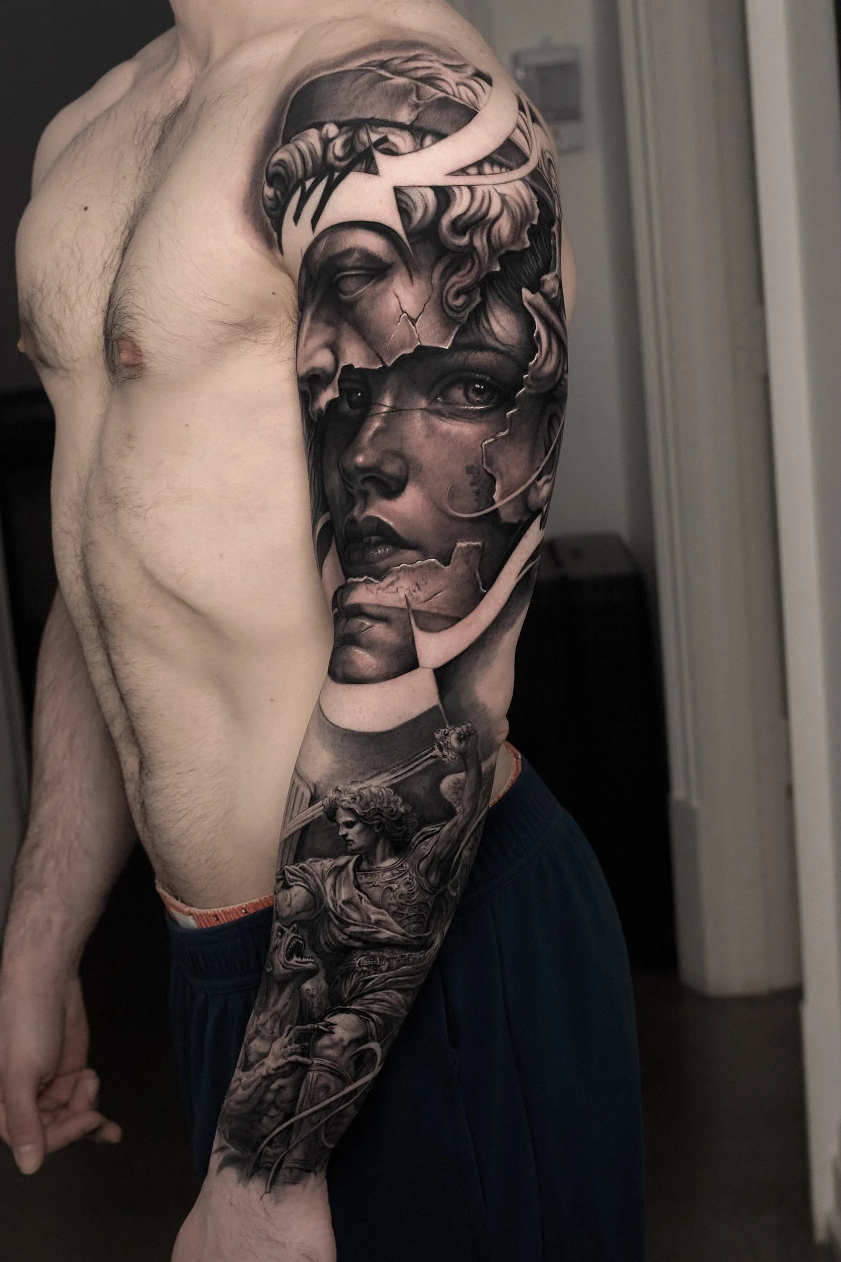black-and-grey-realism-sleeve-portrait-tattoo.jpg