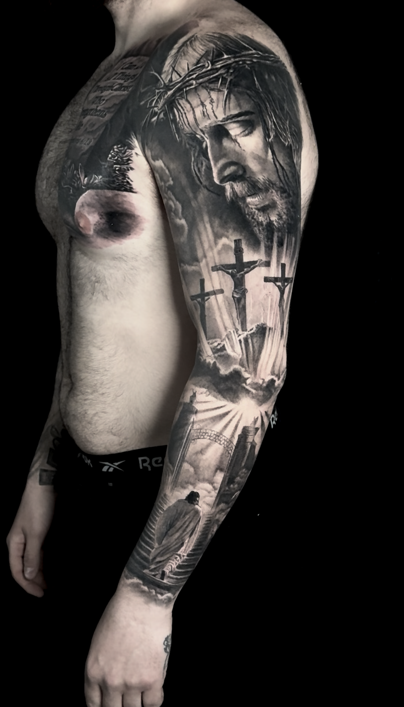 healed-black-and-grey-religious-jesus-portrait-realism-tattoo.png
