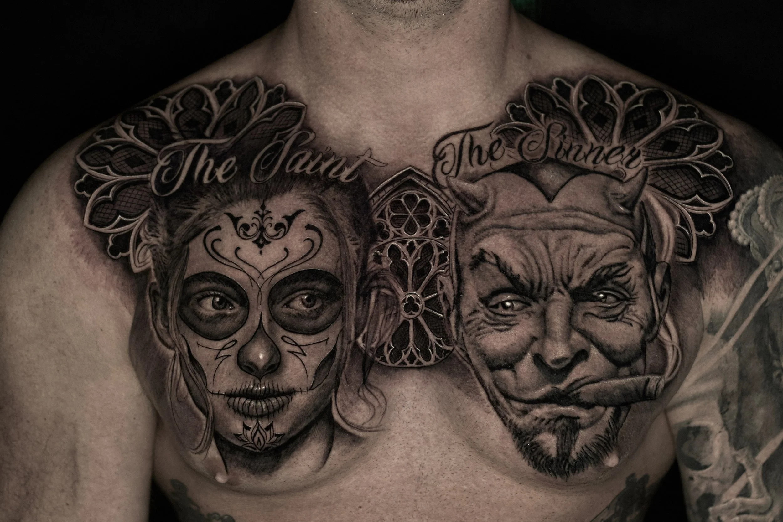 black-and-grey-chest-piece-realism-tattoo.jpg