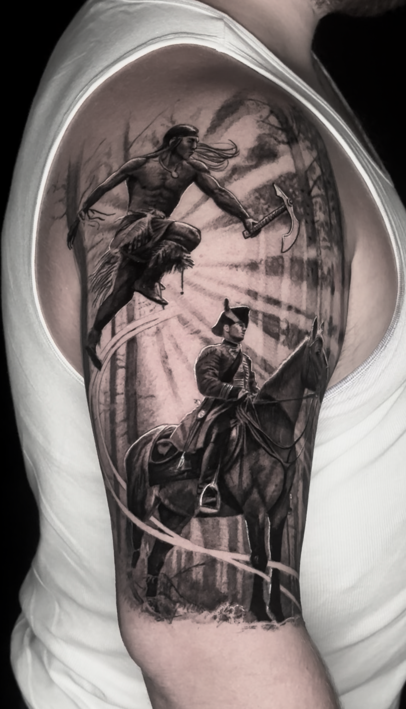 black-and-grey-realism-native-hatchet-colonizer-tattoo.png
