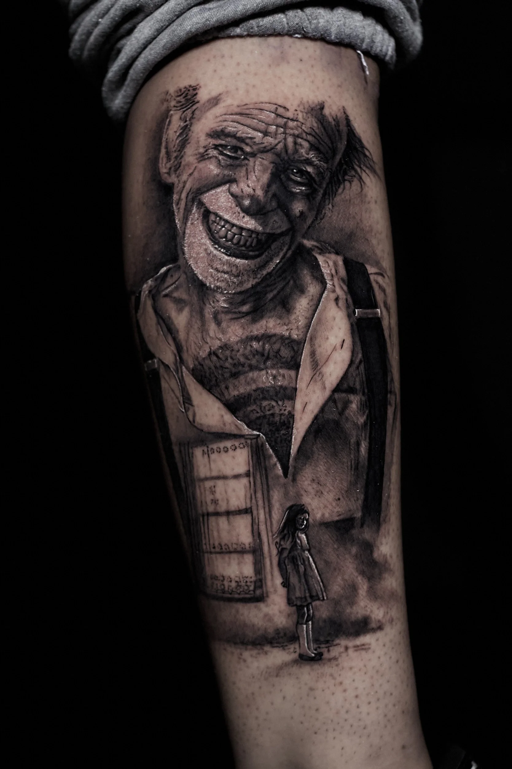 creepy-clown-black-and-grey-realism-tattoo.jpg