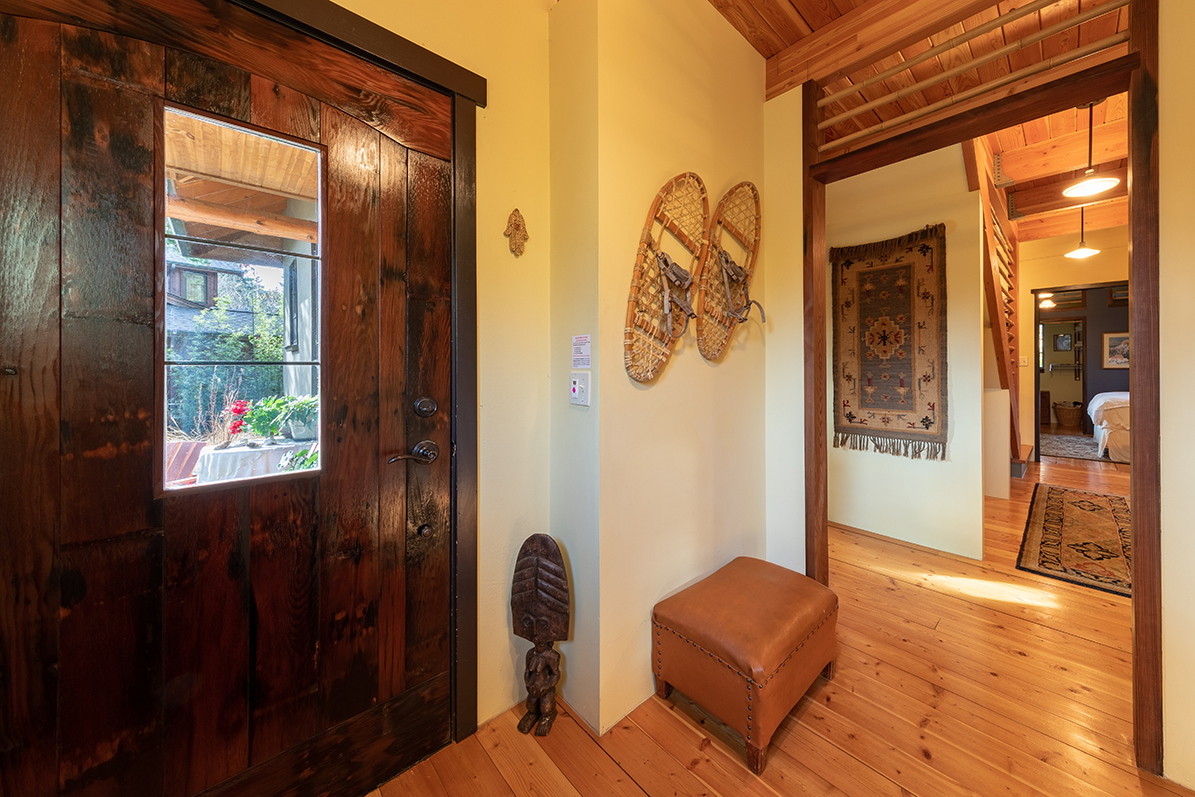  Reclaimed wood is used in many ways throughout the home, including the front door, made from redwood barrels that stored marmalade in a former life. 