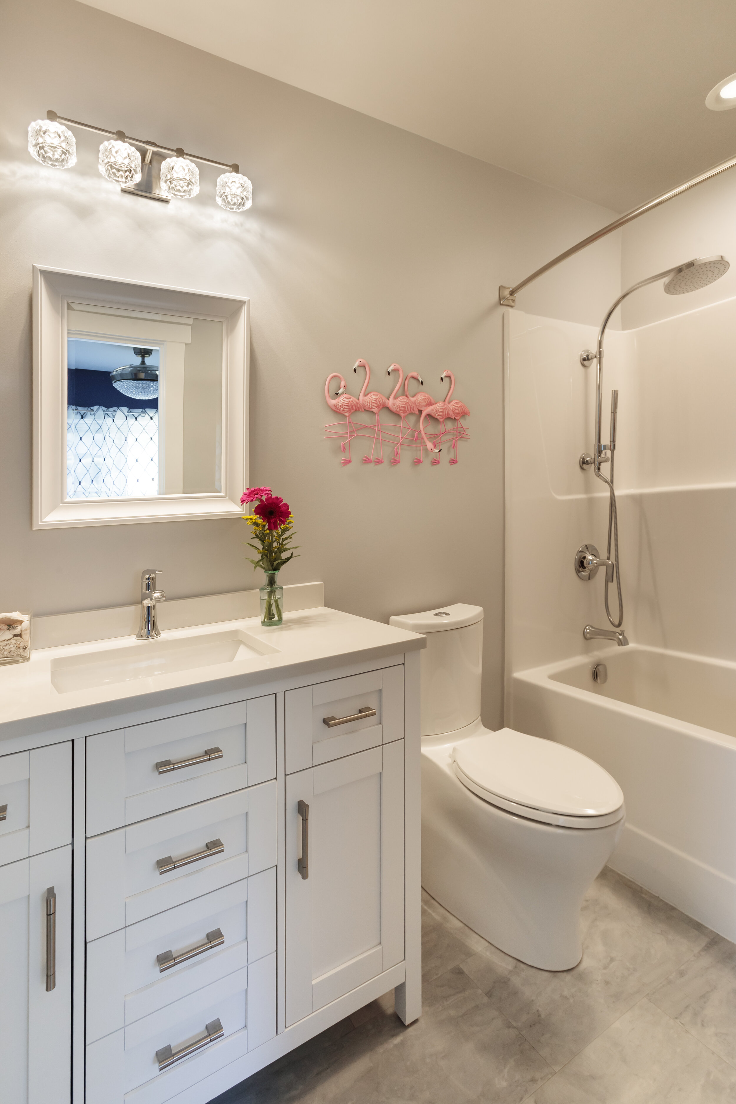  The bathroom includes a soaking tub and a full-length mirrored medicine cabinet behind the door. 