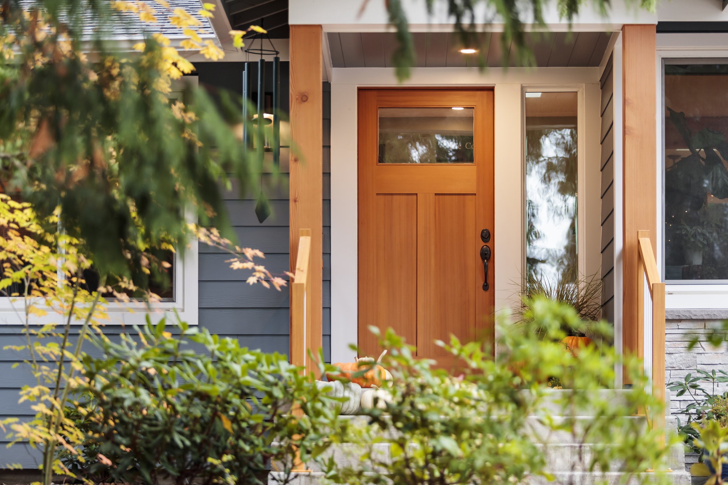  In both the front and back, enlarged entries provide covered indoor-outdoor transition space and a more inviting presence. Stairs and landing are brushed concrete, with aluminum railings that are nearly maintenance free.&nbsp; 