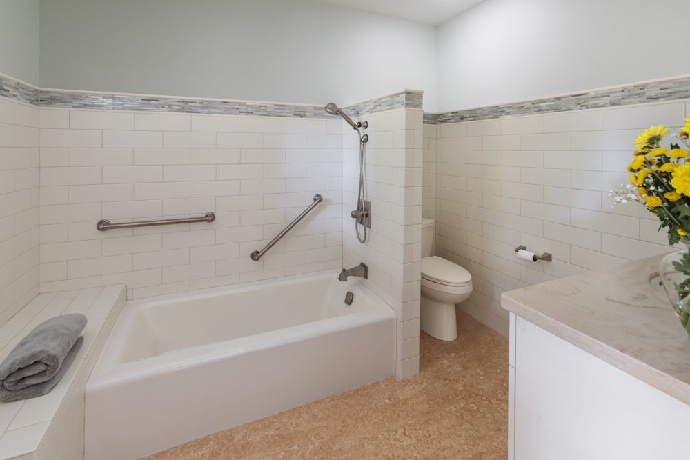  A heated bench seat and grab bars make it easier and safer to get in and out of the tub.  