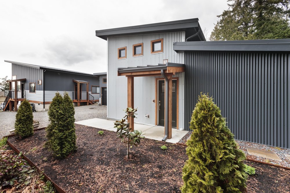  A high-performance building shell built with  SIP panels  and super-insulated, air-sealed walls minimize air leakage. A blower door test revealed just 1.2 air exchanges per hour; Washington energy code requires 5 at a minimum; the Passive House stan