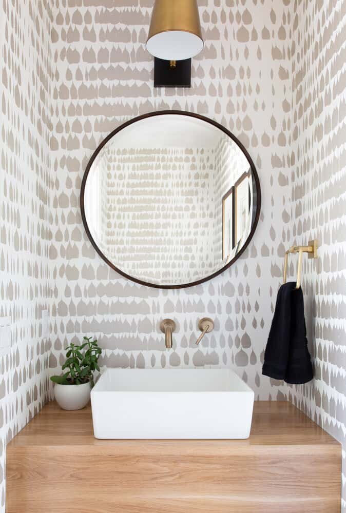 modern+powder+room+with+wallpaper+and+wood+vanity.jpeg