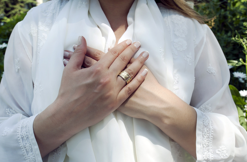 White+Shirt+Woman+Hands+Over+Heart.jpg