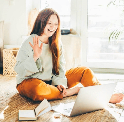 Woman attending an online therapy session from home, participating in virtual eating disorder treatment