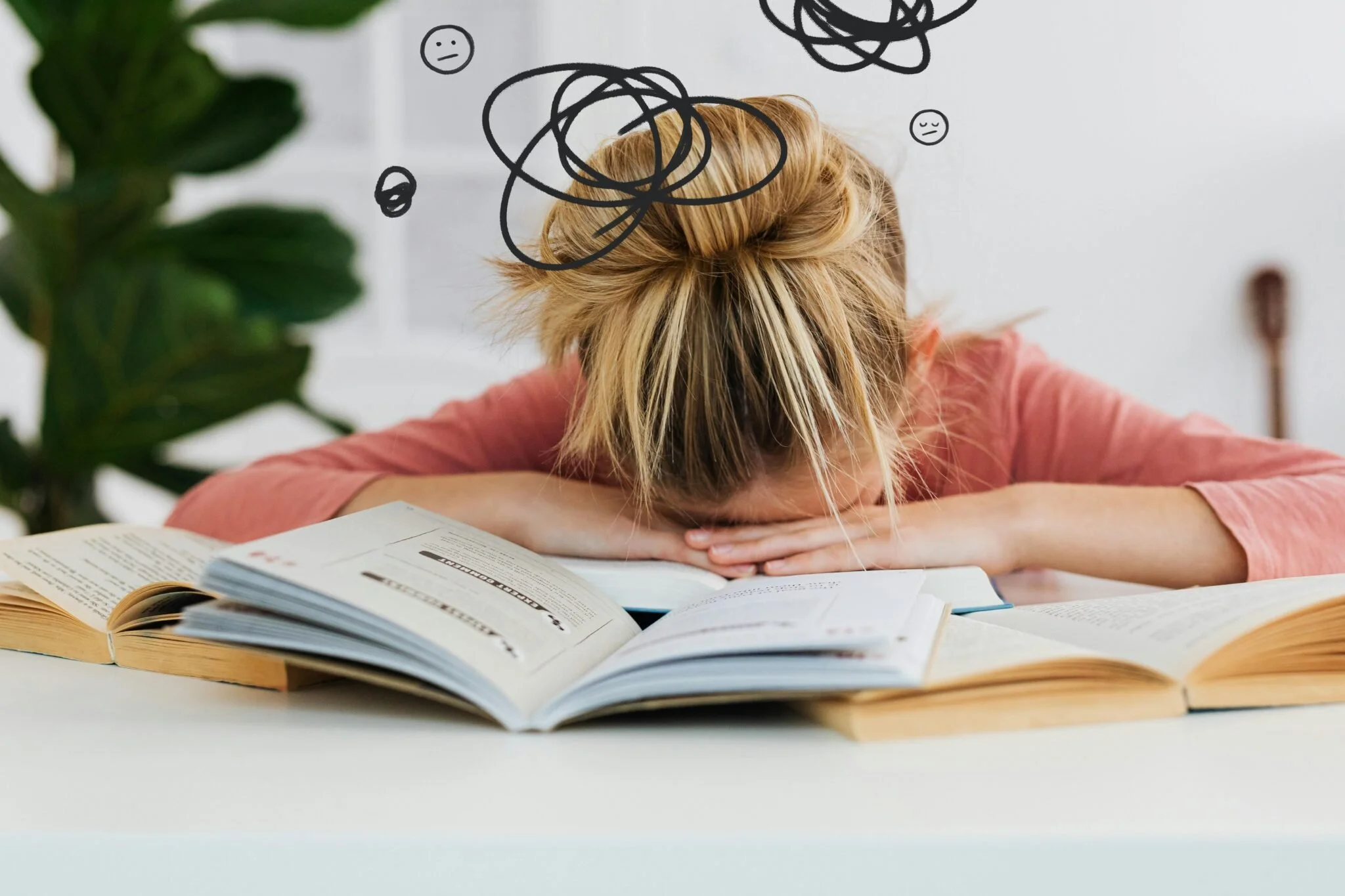 Young girl resting her head on open textbooks, surrounded by doodles representing confusion and overwhelm—symbolizing brain fog and mental fatigue often associated with eating disorders and nutritional deficiencies.