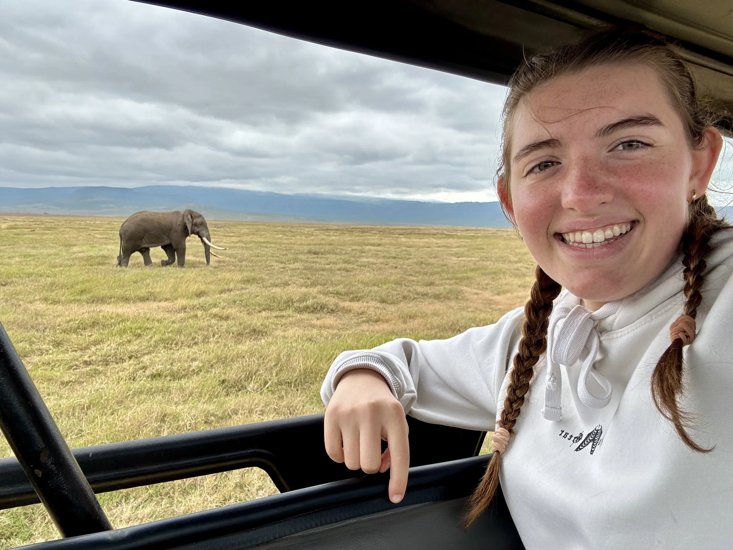 Izzy 2025 Tanzania with Elephant in Crater.jpeg