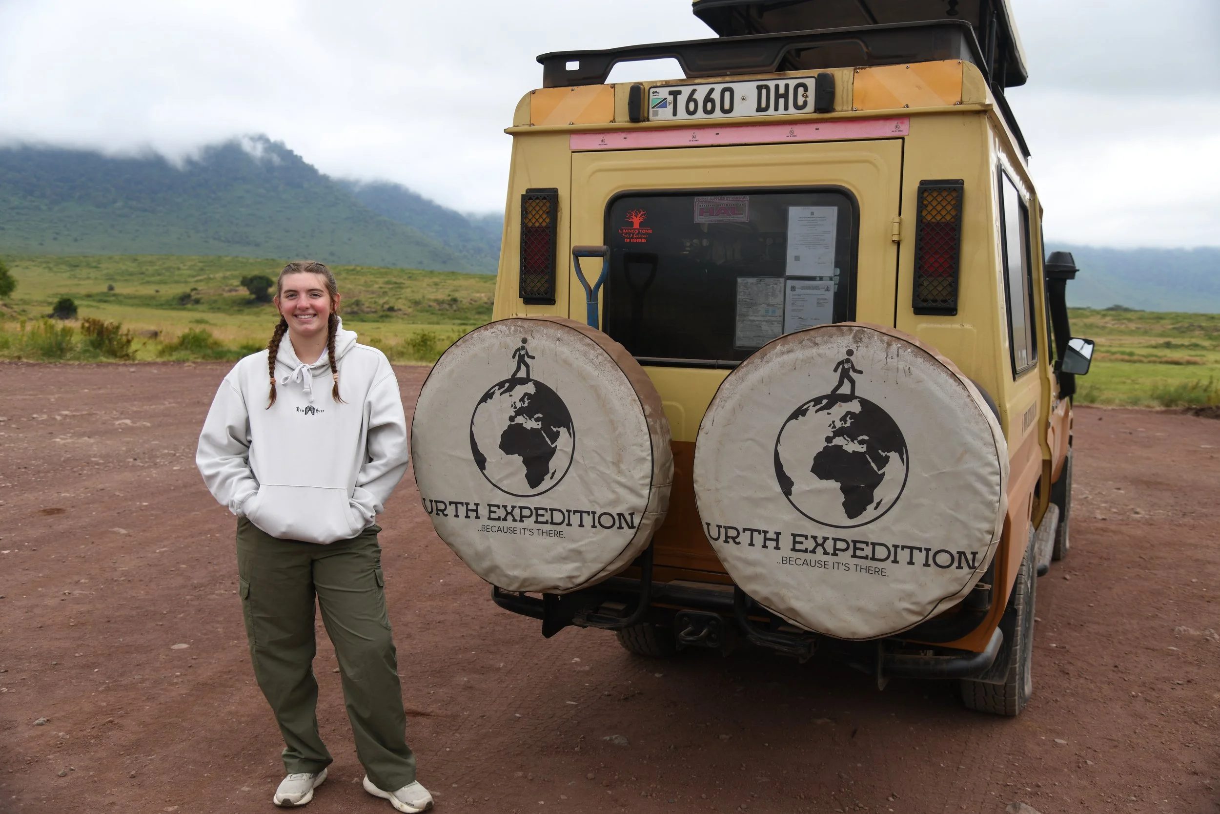 Izzy 2025 Tanzania with Safari Car.jpeg