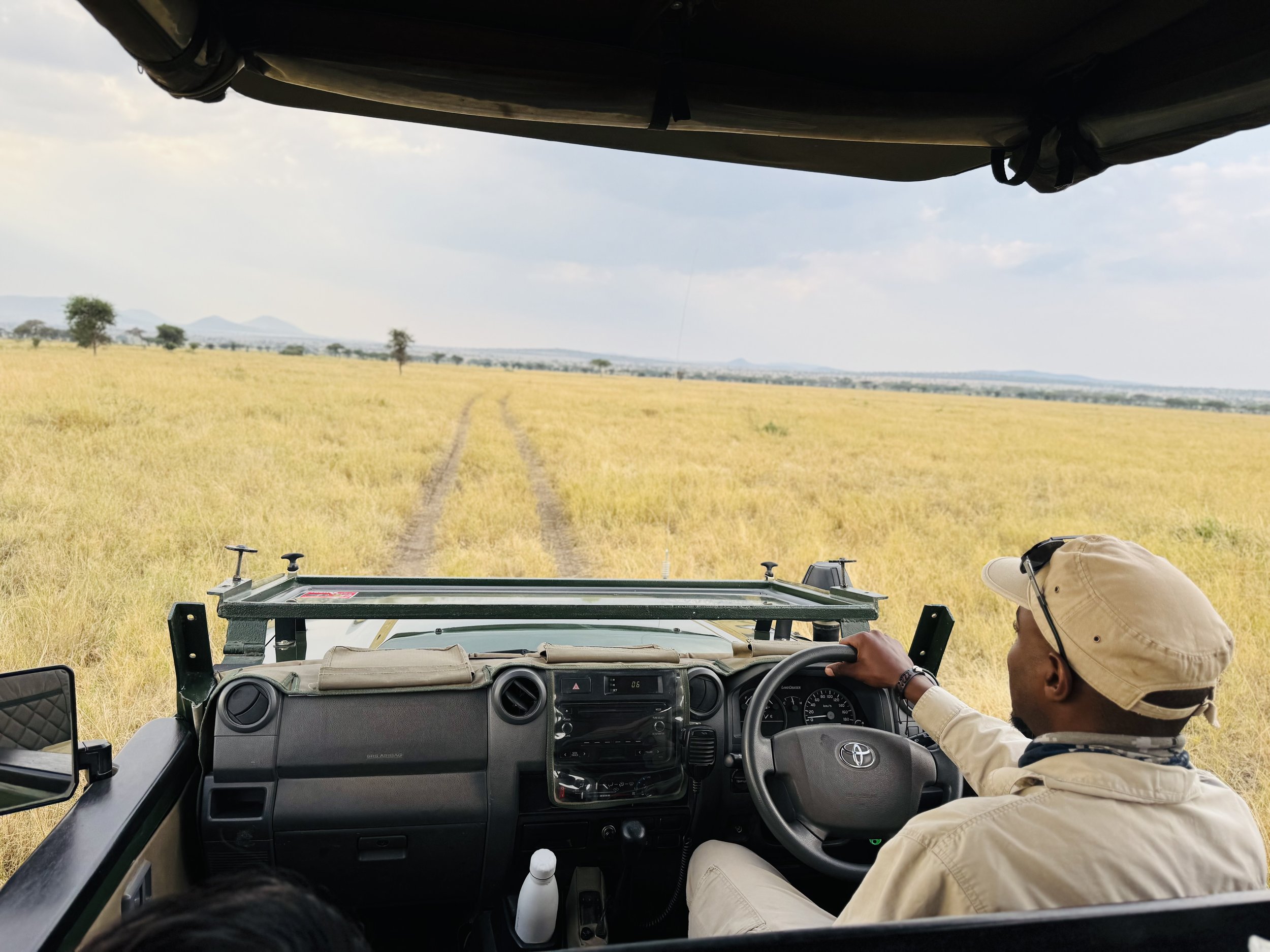 Safari jeep driving though Serengeti with Elena.jpeg