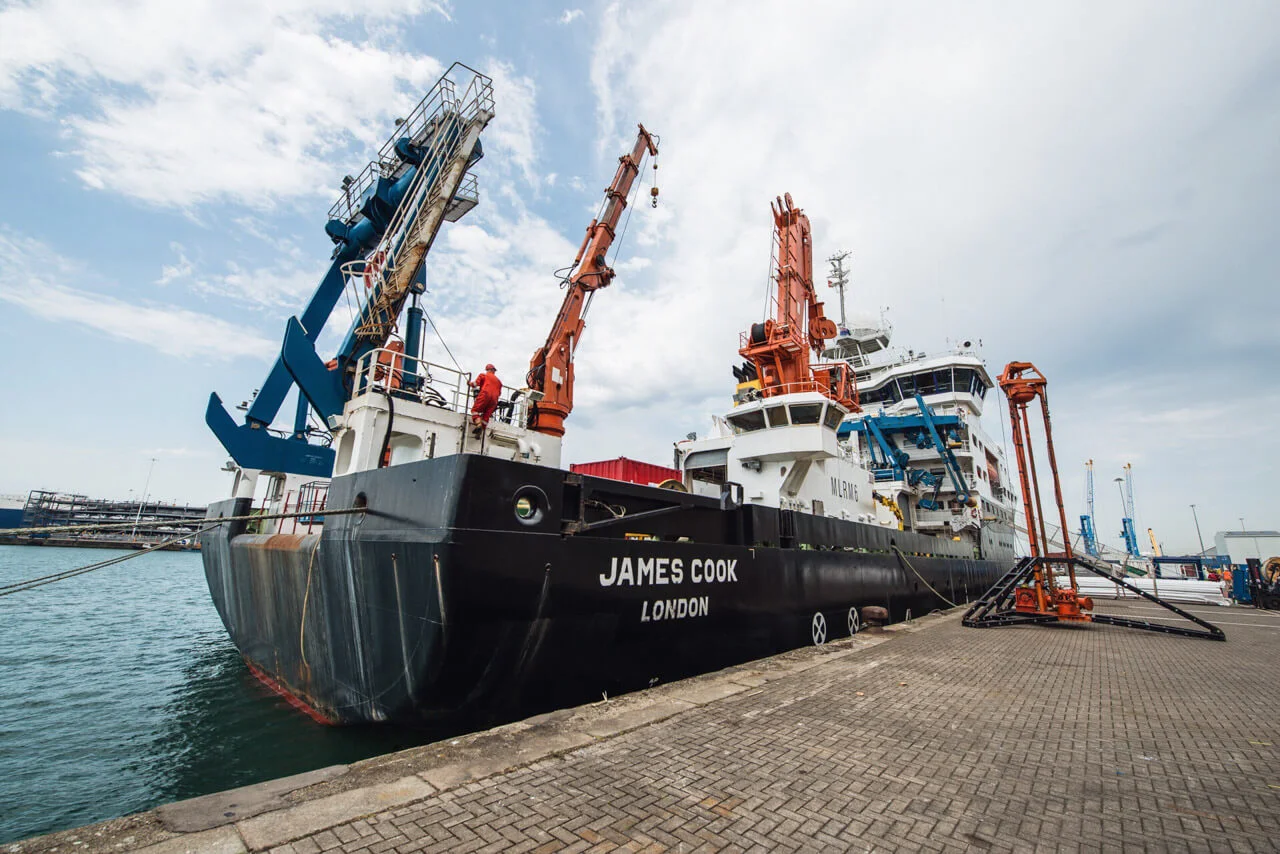 RRS James Cook, during mobilisation, with the BGS' 'Vibrocorer' dockside.