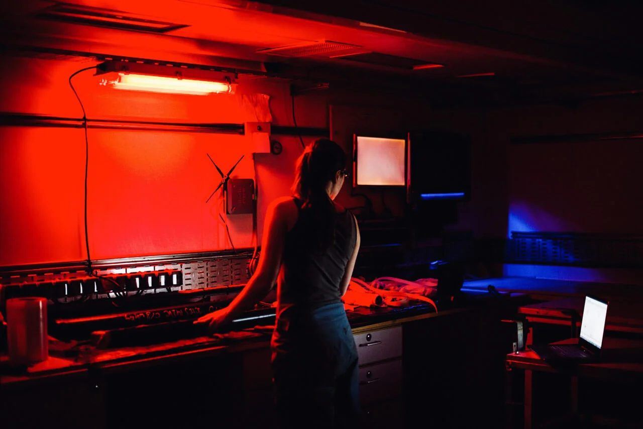 JC123, RRS James Cook, 2015. In the ship's dark room, Dr Louise Callard analyses the next batch of core samples.