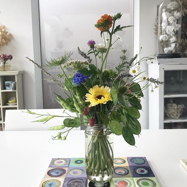 Raspberries and Honesty alongside flowers from @_wetherly_ 
Lockdown and homeschooling made me rethink this period for creativity. Exchanging my own stitched flowers for real flowers has been a wonderful. Working with colour and constantly on the loo