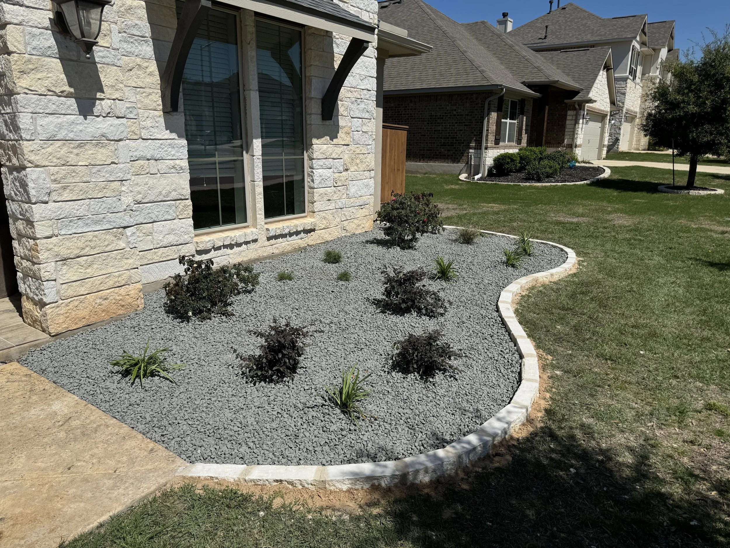 Stone Planter with Irrigation and Plants.jpg