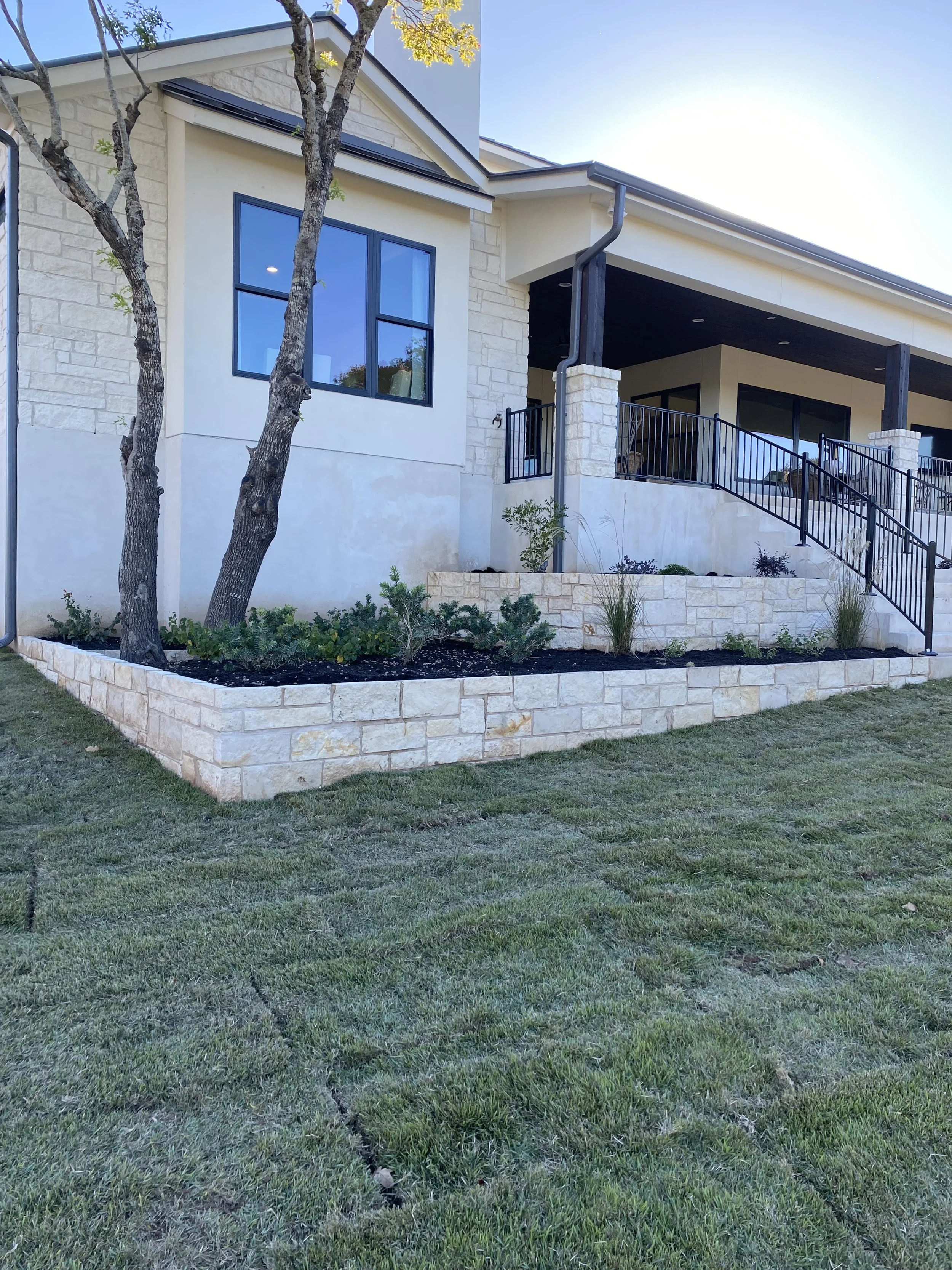 Raised Stone Planter Bed with Irrigation and Plants.jpg