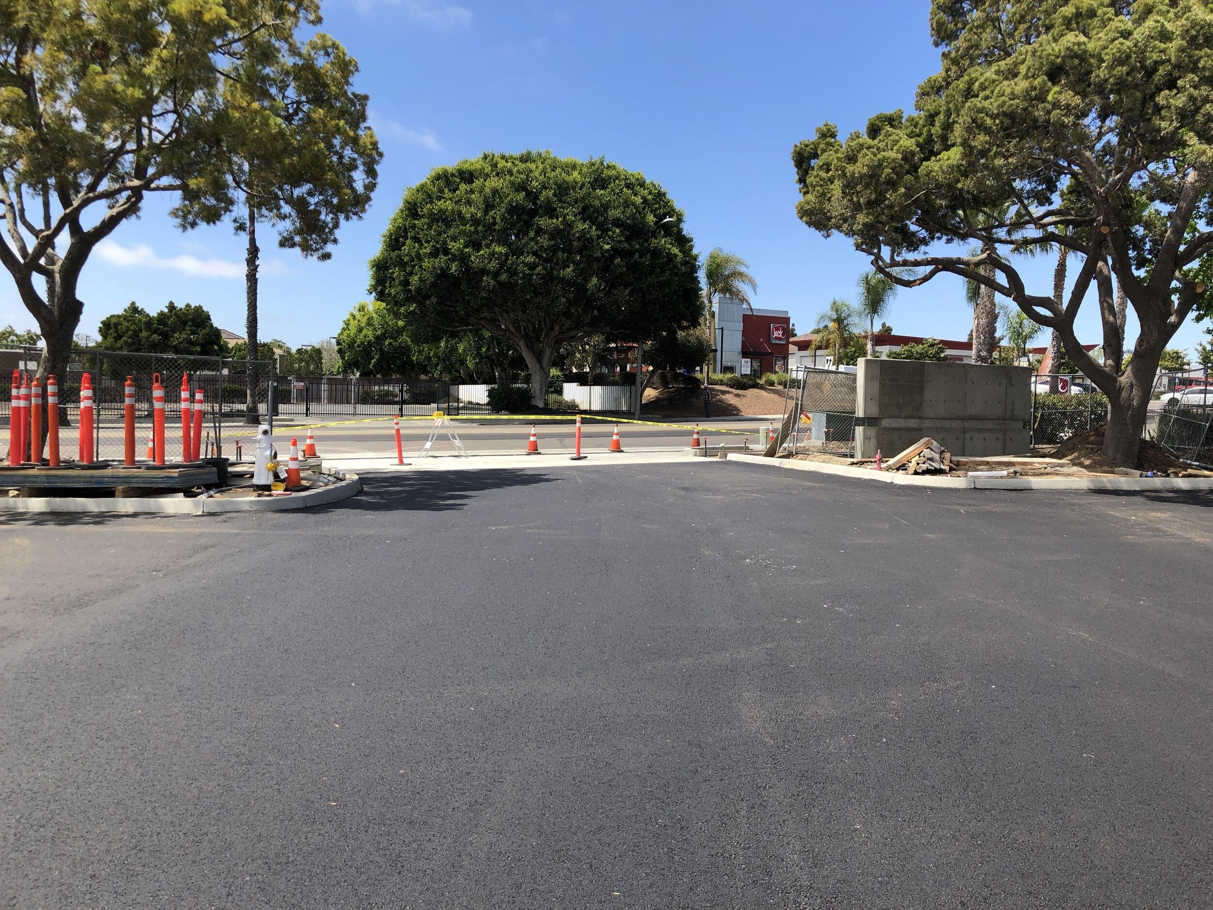  Freshly paved parking lot with cones at the end 