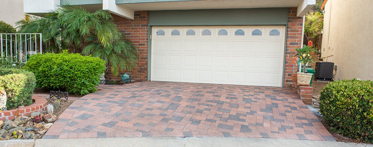  A residential driveway with red pavers 