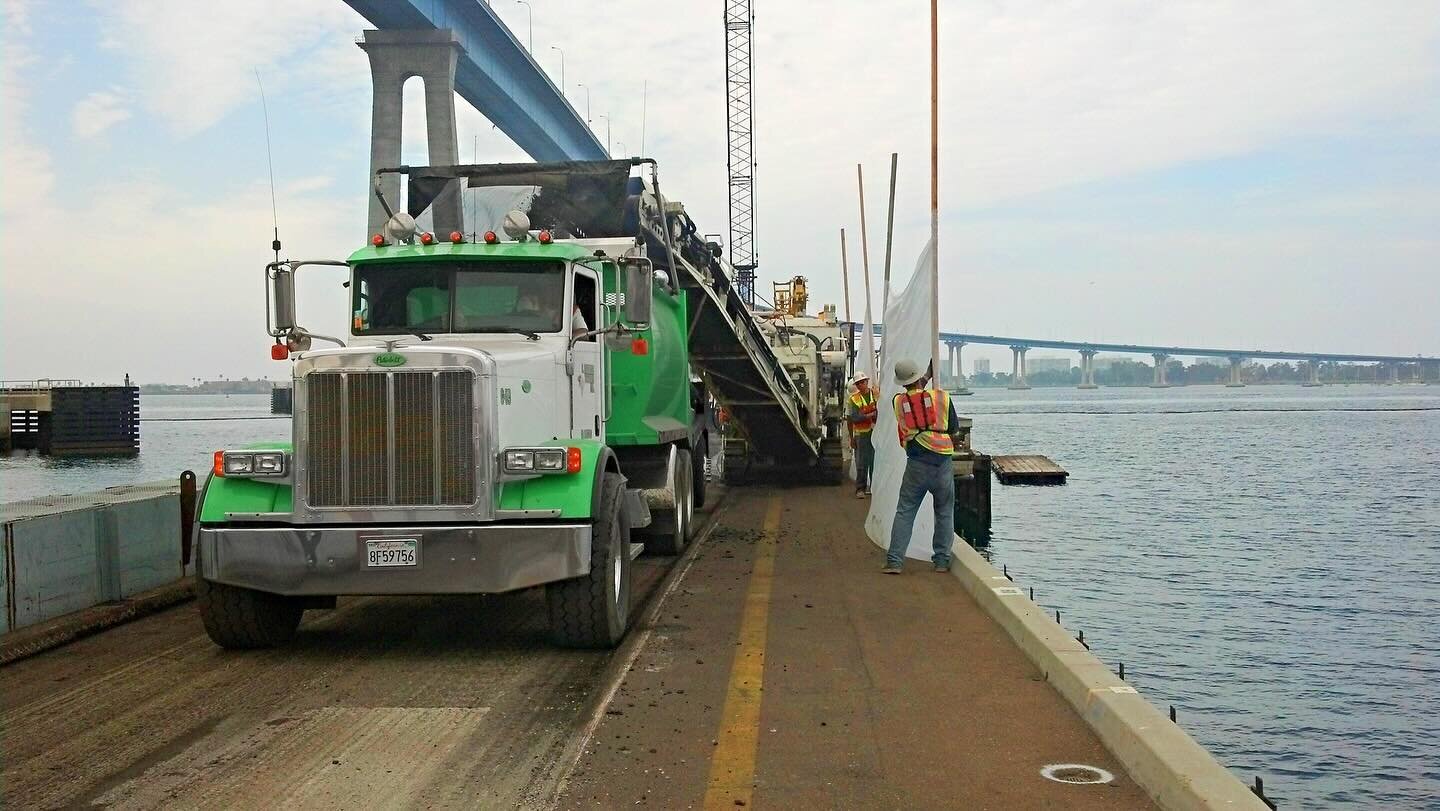 This project was done in 2012 for Continental Maritime of San Diego. We performed a grind and overlay with Petromat paving fabric on the asphalt of the pier. Petromat is a stress absorbing layer that is installed over asphalt to minimize existing cra