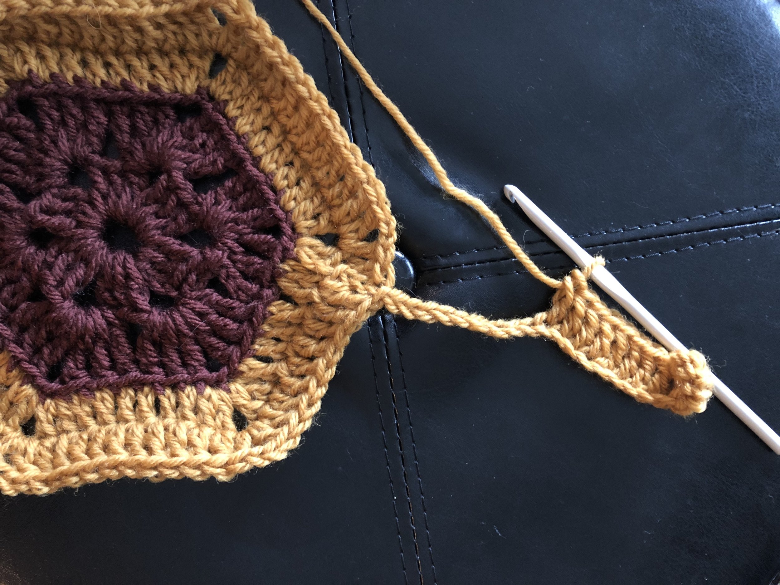 Here we’ve worked the chain stitches and are working our way back up the arm towards the main motif.