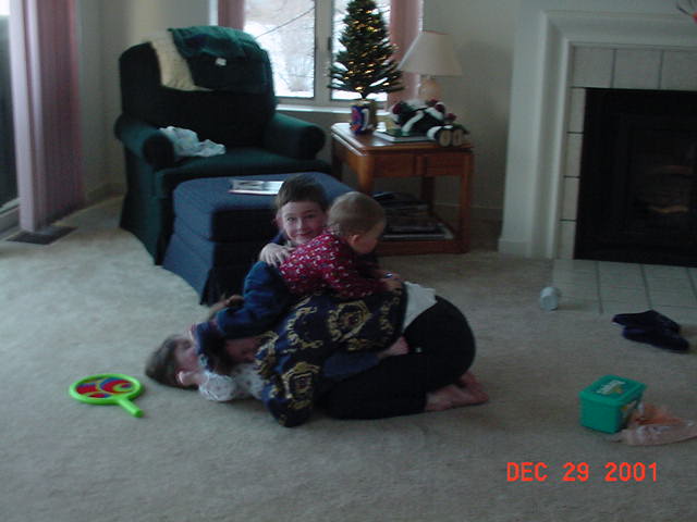 Mom and the kids play tackle