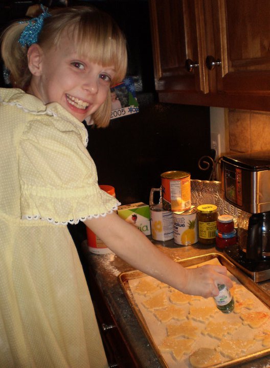 My Sweet Rae, several years ago, making Christmas cookies, all dressed up!