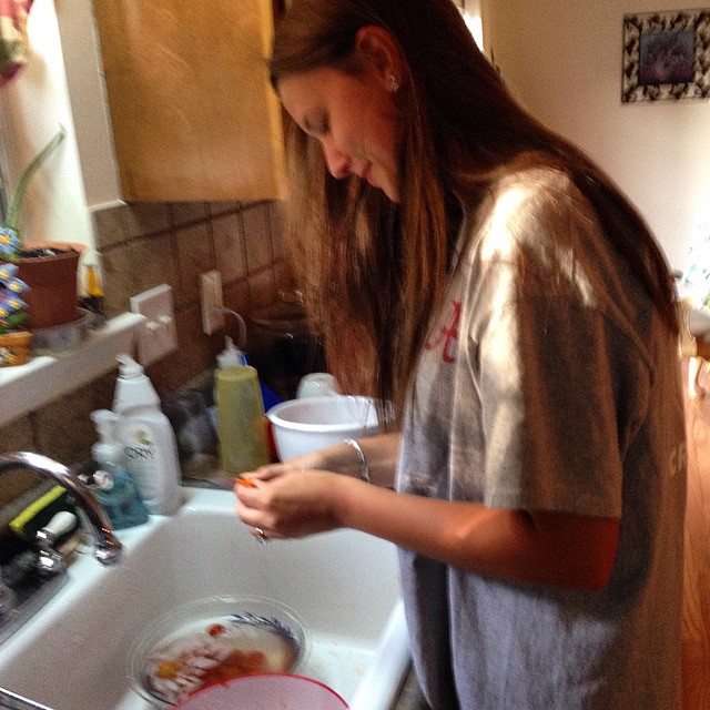 My oldest, Tannar, learning how to prep for canning tomatos.