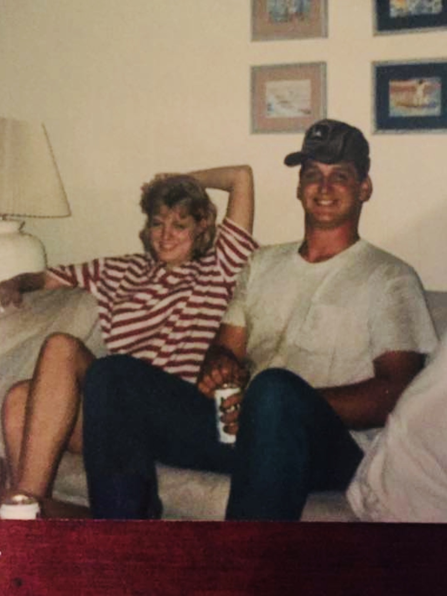 Old photo of Brooke and Danny sitting on a couch.