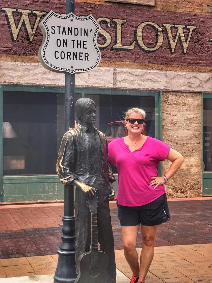 Brooke standing on the corner in Winslow, Arizona.