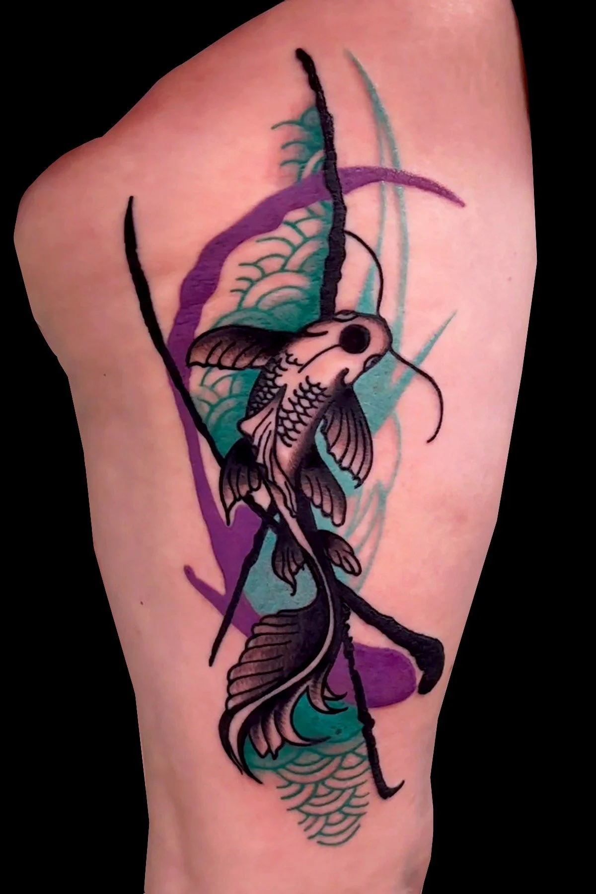 A stylized black ink KOI tattoo accented by vibrant abstract streaks of teal and purple watercolor-style background shading.