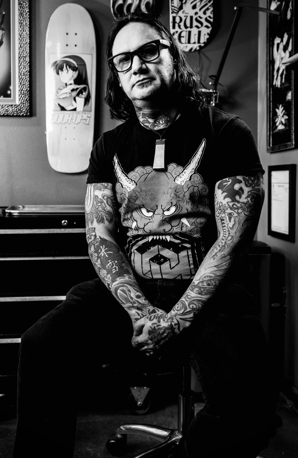 Black and white studio portrait of Matt, known as Kiwi Matt, the principal traditional Japanese Irezumi tattoo artist and founder of Ronin Tattoo Seattle.