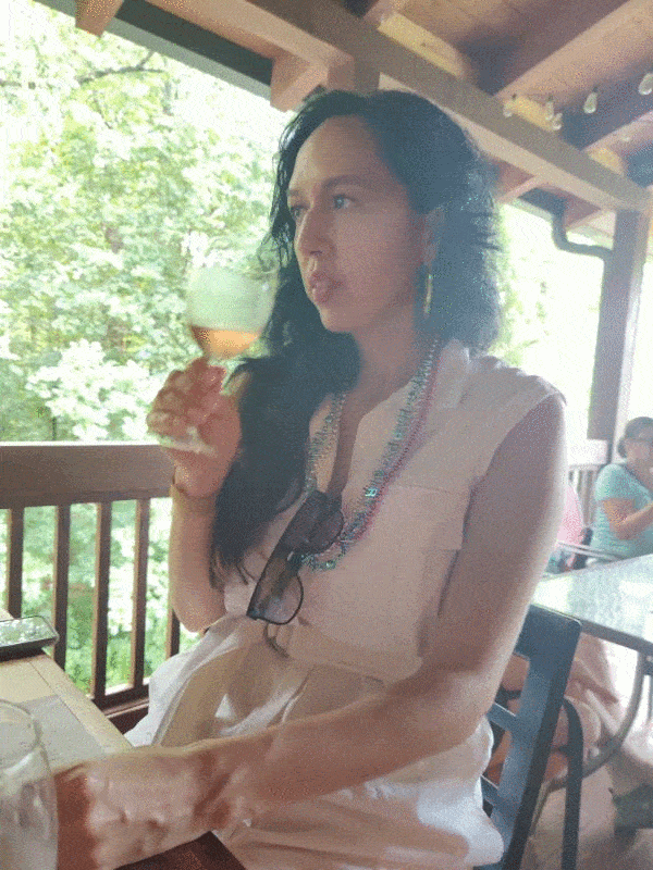 natalie-sipping-wine.gif
