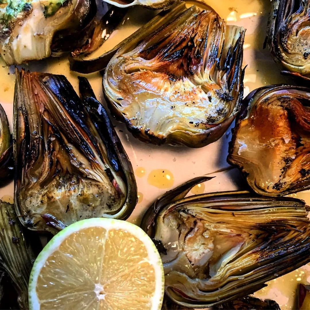 A rainy Saturday morning breakfast of purple artichokes steamed in old white wine and lemon and finished in a maniacally stoked fireplace; eaten with blazing red cheeks and blackened fingertips only occasionally wiped on a frayed and tattered housedress smelling of wood smoke and garlic.
#eatlikenobodyswatching #italy #piedmont #autumn #artichokes #carciofi (at Bossolasco)